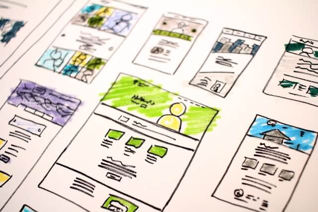 Hand-drawn sketches of multiple landing page layouts representing landing pages designed to convert visitors into website leads.