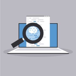 Magnifying glass examining website content on a laptop screen, representing search visibility and website enquiry performance.